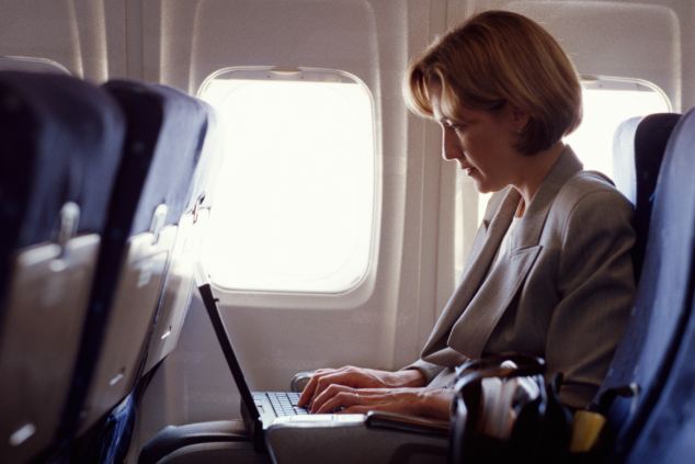 dvt getty woman on plane with laptop